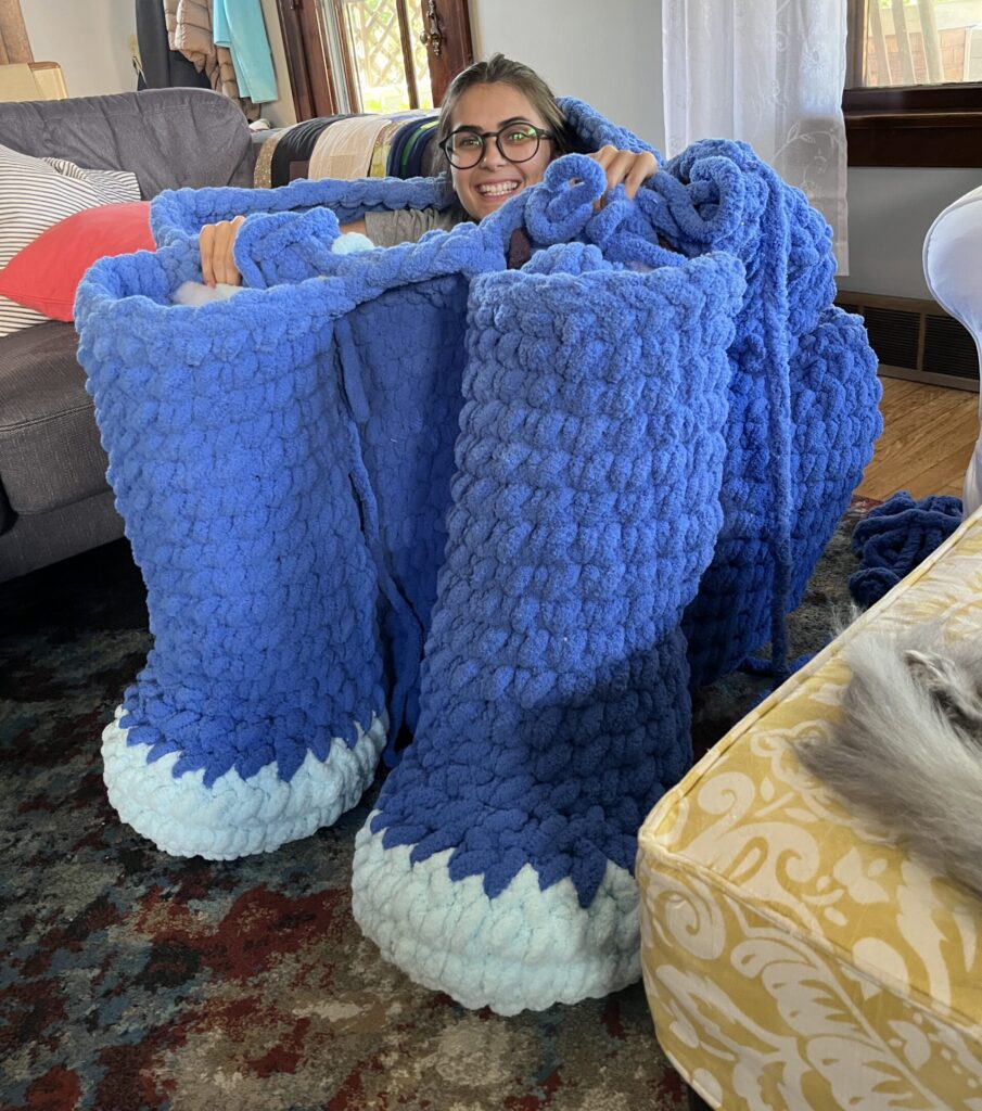 Sitting inside of a giant half-crocheted derpy tiger plush